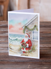 Load image into Gallery viewer, Santa Claus by the Seaside Cottage Christmas Greeting Cards Pack of 8