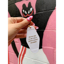 Load image into Gallery viewer, I'm Poly and Yes We Have a Shared Google Calendar Motel Style Keychain in White and Gold | Polyamory Themed Funny Key Tag
