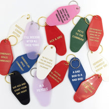 Load image into Gallery viewer, I'm Poly and Yes We Have a Shared Google Calendar Motel Style Keychain in White and Gold | Polyamory Themed Funny Key Tag