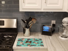 Load image into Gallery viewer, Blue Merle Sheltie Glass Cutting Boards – Durable, Decorative Kitchen Art Large