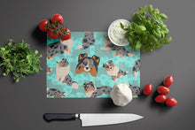 Load image into Gallery viewer, Blue Merle Sheltie Glass Cutting Boards – Durable, Decorative Kitchen Art Large