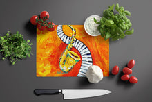 Load image into Gallery viewer, Something Blues Saxaphone and Piano Glass Cutting Boards – Durable, Decorative Kitchen Art