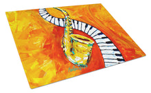 Load image into Gallery viewer, Something Blues Saxaphone and Piano Glass Cutting Boards – Durable, Decorative Kitchen Art
