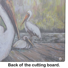 Load image into Gallery viewer, Three Pelicans on a Pier Glass Cutting Boards – Durable, Decorative Kitchen Art