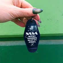 Load image into Gallery viewer, Needy Anxious Slutty Angel Space Explorer Motel Style Keychain in Dark Blue
