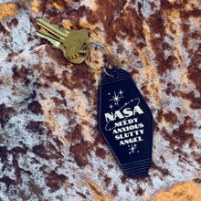Load image into Gallery viewer, Needy Anxious Slutty Angel Space Explorer Motel Style Keychain in Dark Blue