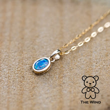 Load image into Gallery viewer, Oval Shaped Australian Triplet Opal Necklace in 14k Yellow Gold