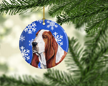 Load image into Gallery viewer, Basset Hound Winter Snowflakes Holiday Ornament - Round Ceramic Ornament – Artist-Designed Keepsake Decoration SC9372