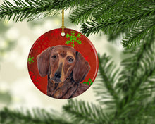 Load image into Gallery viewer, Dachshund Red Snowflakes Holiday Christmas Ornament - Round Ceramic Ornament – Artist-Designed Keepsake Decoration SC9408