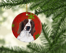 Load image into Gallery viewer, Welsh Springer Spaniel Red Snowflakes Holiday Christmas Ornament - Round Ceramic Ornament – Artist-Designed Keepsake Decoration SC9420