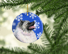 Load image into Gallery viewer, Keeshond Winter Snowflakes Holiday Christmas Ornament - Round Ceramic Ornament – Artist-Designed Keepsake Decoration SS4626
