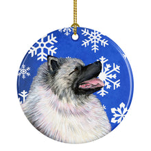Load image into Gallery viewer, Keeshond Winter Snowflakes Holiday Christmas Ornament - Round Ceramic Ornament – Artist-Designed Keepsake Decoration SS4626