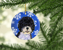 Load image into Gallery viewer, Portuguese Water Dog Winter Snowflakes Holiday Christmas Ornament - Round Ceramic Ornament – Artist-Designed Keepsake Decoration