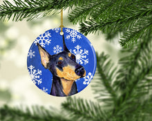 Load image into Gallery viewer, Doberman Winter Snowflakes Holiday Christmas Ornament - Round Ceramic Ornament – Artist-Designed Keepsake Decoration SS4633