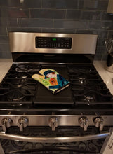 Load image into Gallery viewer, Lady driving with her Yorkie Oven Mitt SS8550OVMT