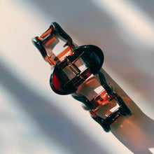 Load image into Gallery viewer, Velvet Claws Hair Clip | '80s Squiggle in Amber | Claw Clip in Velvet Travel Bag