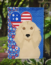 Load image into Gallery viewer, Longhair Cream Dachshund Patriotic Heart Garden Flag – Red, White &amp; Blue Dog Decor with Star Background