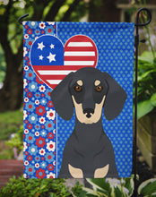 Load image into Gallery viewer, Black and Cream Dachshund Patriotic Heart Garden Flag – Red, White &amp; Blue Dog Decor with Star Background