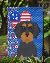 Load image into Gallery viewer, Wirehair Black and Tan Dachshund Patriotic Heart Garden Flag – Red, White &amp; Blue Dog Decor with Star Background