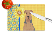 Load image into Gallery viewer, Summer Sunflowers Grizzle and Tan Airedale Terrier Glass Cutting Boards – Durable, Decorative Kitchen Art Large