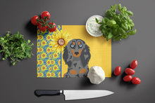 Load image into Gallery viewer, Summer Sunflowers Longhair Blue and Tan Dapple Dachshund Glass Cutting Boards – Durable, Decorative Kitchen Art Large