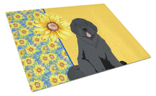 Load image into Gallery viewer, Summer Sunflowers Black Newfoundland Glass Cutting Boards – Durable, Decorative Kitchen Art Large