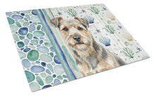 Load image into Gallery viewer, Grizzle and Tan Norfolk Terrier Coastal Sea Glass Glass Cutting Board