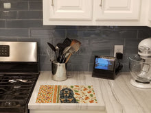 Load image into Gallery viewer, Black and Tan Bloodhound Heirloom Fall Glass Cutting Board
