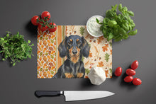 Load image into Gallery viewer, Longhaired Black and Tan Dachshund Heirloom Fall Glass Cutting Board