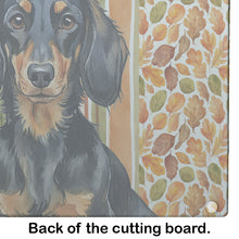 Load image into Gallery viewer, Longhaired Black and Tan Dachshund Heirloom Fall Glass Cutting Board