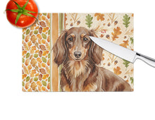 Load image into Gallery viewer, Longhaired Chocolate and Tan Dachshund Heirloom Fall Glass Cutting Board