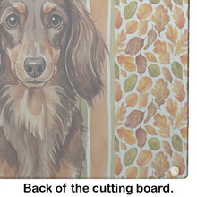 Load image into Gallery viewer, Longhaired Chocolate and Tan Dachshund Heirloom Fall Glass Cutting Board