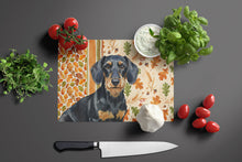Load image into Gallery viewer, Wirehaired Black and Tan Dachshund Heirloom Fall Glass Cutting Board