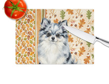 Load image into Gallery viewer, Blue Merle Pomeranian Heirloom Fall Glass Cutting Board