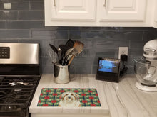 Load image into Gallery viewer, White and Tan Bearded Collie Christmas PoinsettIas Glass Cutting Board