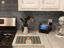 Load image into Gallery viewer, Orange and White Brittany Christmas PoinsettIas Glass Cutting Board