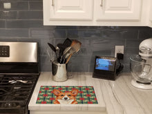 Load image into Gallery viewer, Red Cardigan Welsh Corgi Christmas PoinsettIas Glass Cutting Board