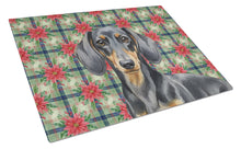 Load image into Gallery viewer, Black and Tan Dachshund Christmas PoinsettIas Glass Cutting Board