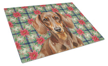 Load image into Gallery viewer, Chocolate and Tan Dachshund Christmas PoinsettIas Glass Cutting Board