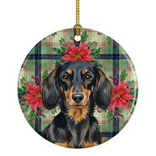 Load image into Gallery viewer, Longhaired Black and Tan Dachshund Christmas PoinsettIas Ceramic Ornament