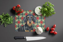 Load image into Gallery viewer, Wirehaired Black and Tan Dachshund Christmas PoinsettIas Glass Cutting Board