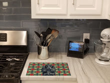 Load image into Gallery viewer, Black English Cocker Spaniel Christmas PoinsettIas Glass Cutting Board