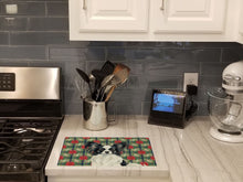 Load image into Gallery viewer, Black and White Papillon Christmas PoinsettIas Glass Cutting Board