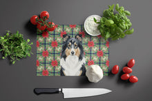 Load image into Gallery viewer, Tricolor Sheltie Christmas PoinsettIas Glass Cutting Board