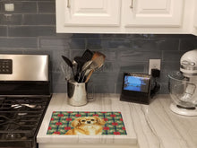 Load image into Gallery viewer, Gold Tibetan Spaniel Christmas PoinsettIas Glass Cutting Board