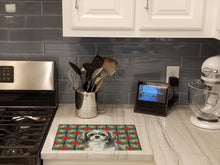 Load image into Gallery viewer, Grey and White Tibetan Spaniel Christmas PoinsettIas Glass Cutting Board