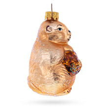 Load image into Gallery viewer, Otter Holding a Log Glass Christmas Ornament