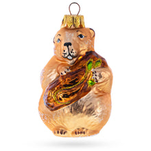 Load image into Gallery viewer, Otter Holding a Log Glass Christmas Ornament