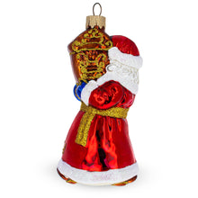 Load image into Gallery viewer, Santa Holding Grandfather Clock Glass Christmas Ornament