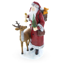Load image into Gallery viewer, Santa Holding Christmas Tree and Bell by Reindeer Figurine 12 Inches